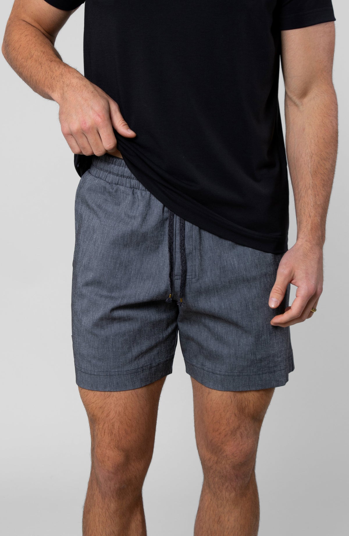 LEISURE LAB® Dockside Short in grey technical fabric with an elastic waistband and braided drawcord on a male model.