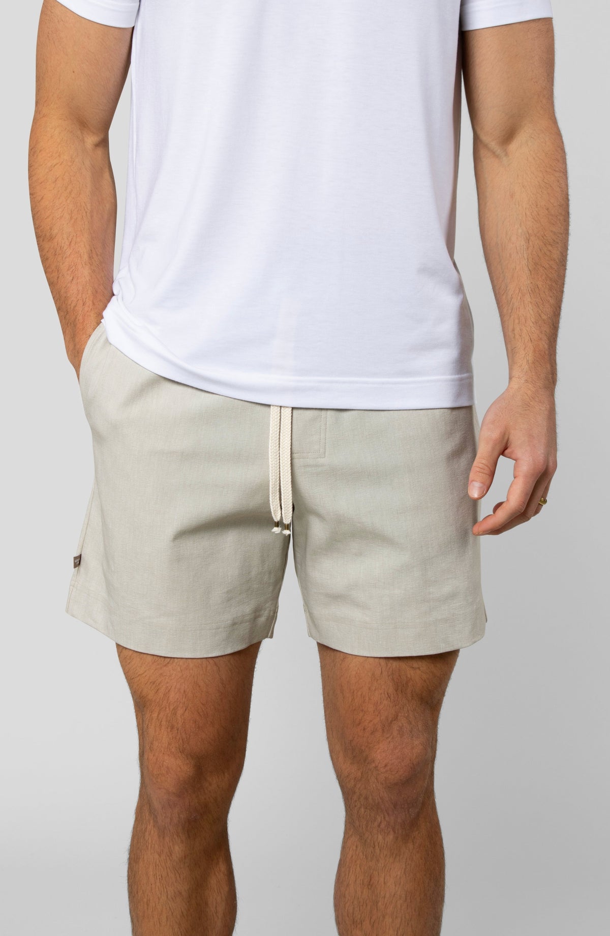 LEISURE LAB® Dockside Short in beige technical fabric with a braided drawcord and elastic waistband on a model