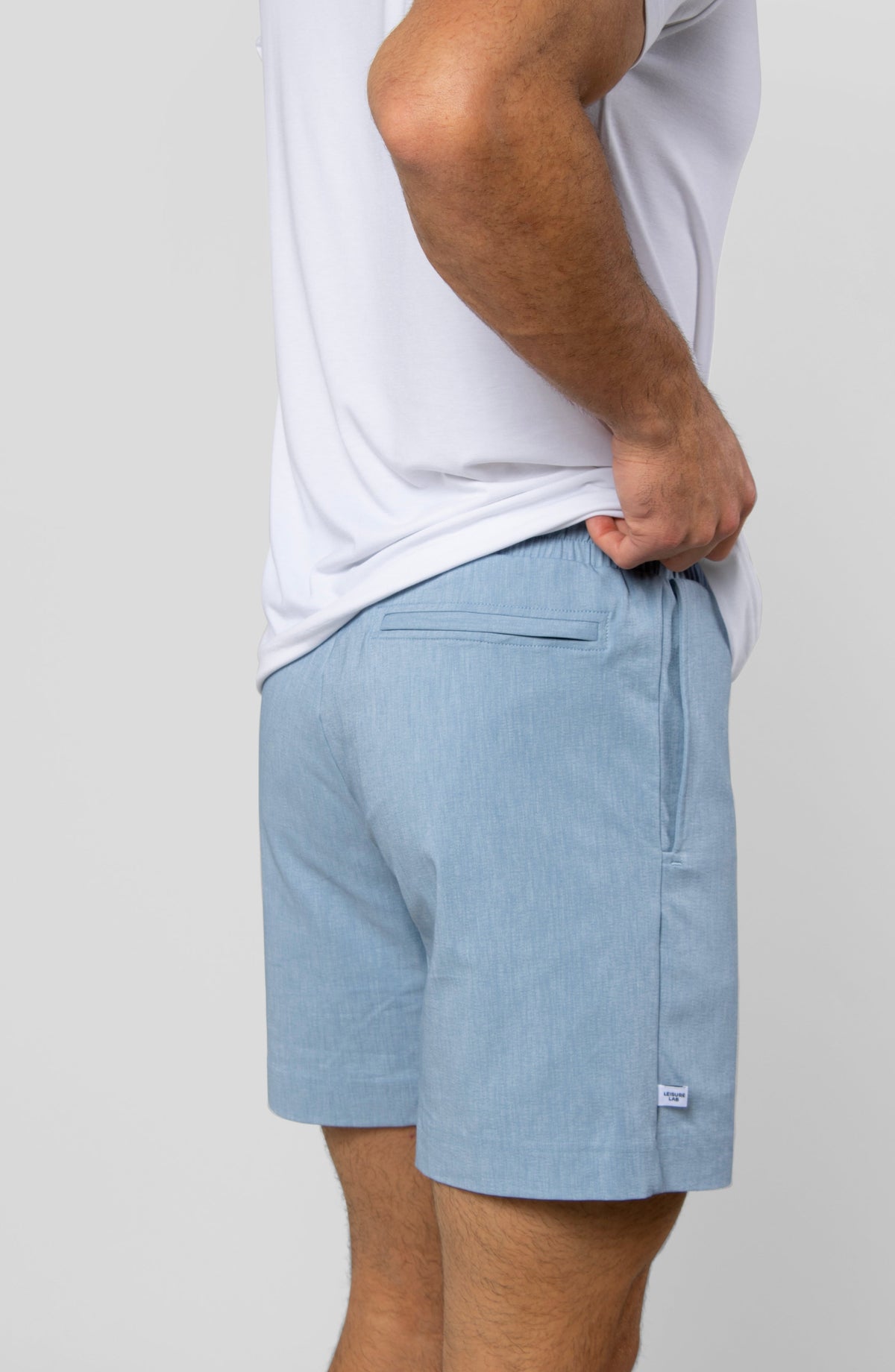 LEISURE LAB® Dockside Short in light blue technical fabric with a back welt zipper pocket and elastic waistband.