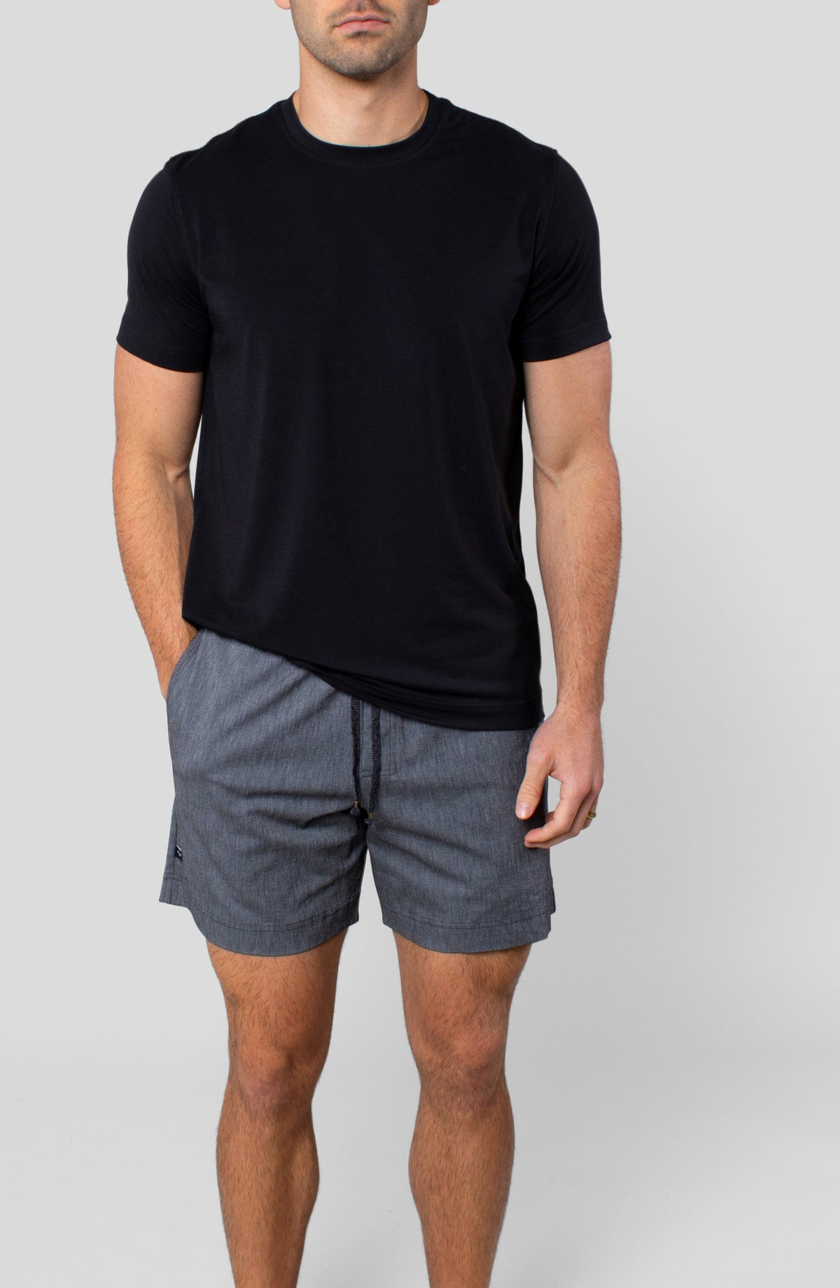 LEISURE LAB® Dockside Short in grey technical fabric with elastic waistband and braided drawcord on a male model.