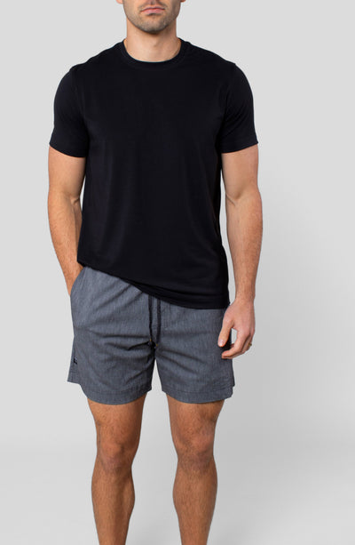 LEISURE LAB® Dockside Short in grey technical fabric with elastic waistband and braided drawcord on a male model.
