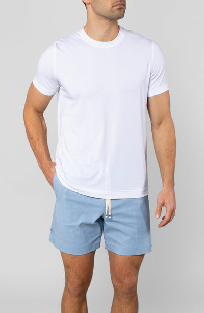 Model wearing LEISURE LAB® Dockside Short in light blue with a white t-shirt, featuring a braided cotton drawcord.