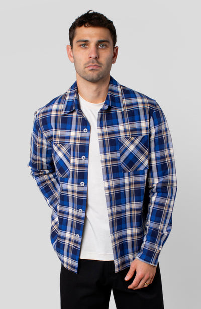 LEISURE LAB® Outlander button-up shirt in blue and white plaid cotton flannel with dual chest pockets on a male model